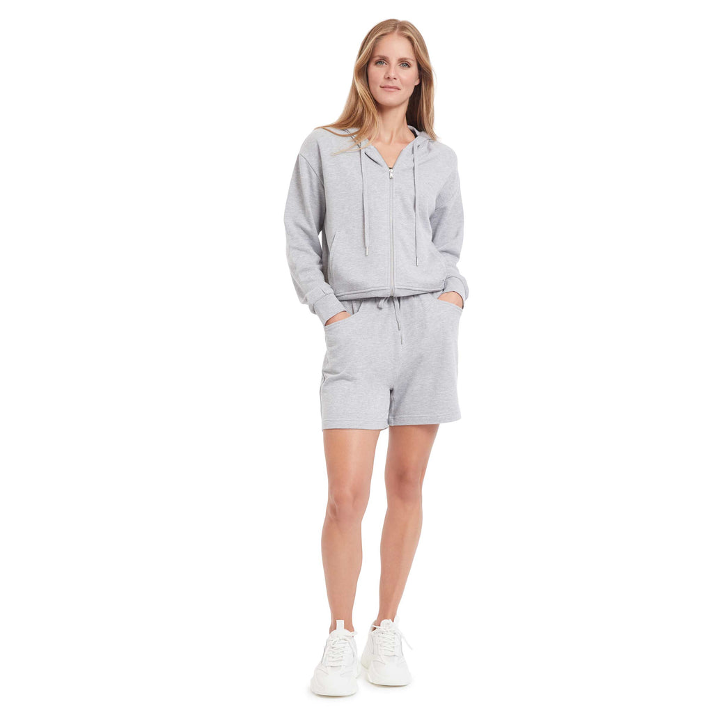 Woman wearing PSK Collective Zip up Hoodie in heather grey color full body view