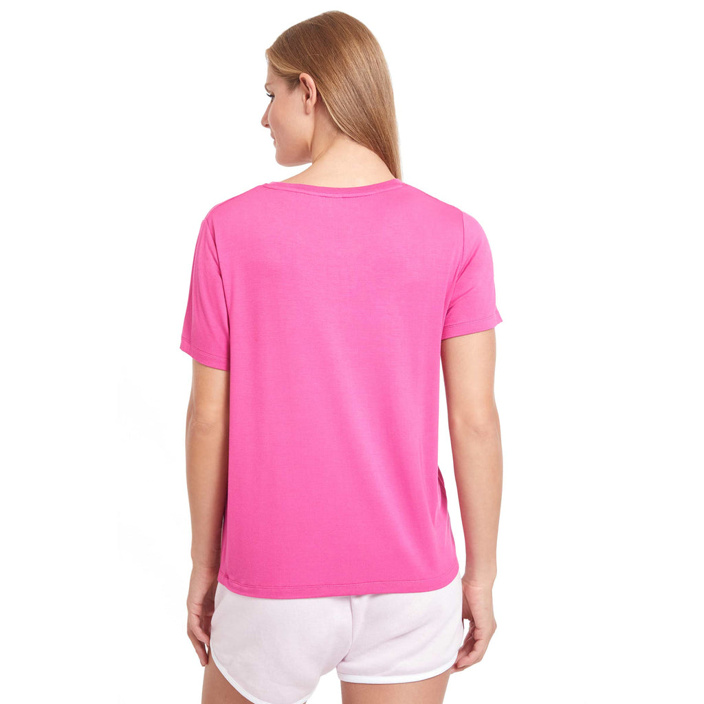 Woman wearing PSK Collective Calligraphic Tee in fuschia from the back