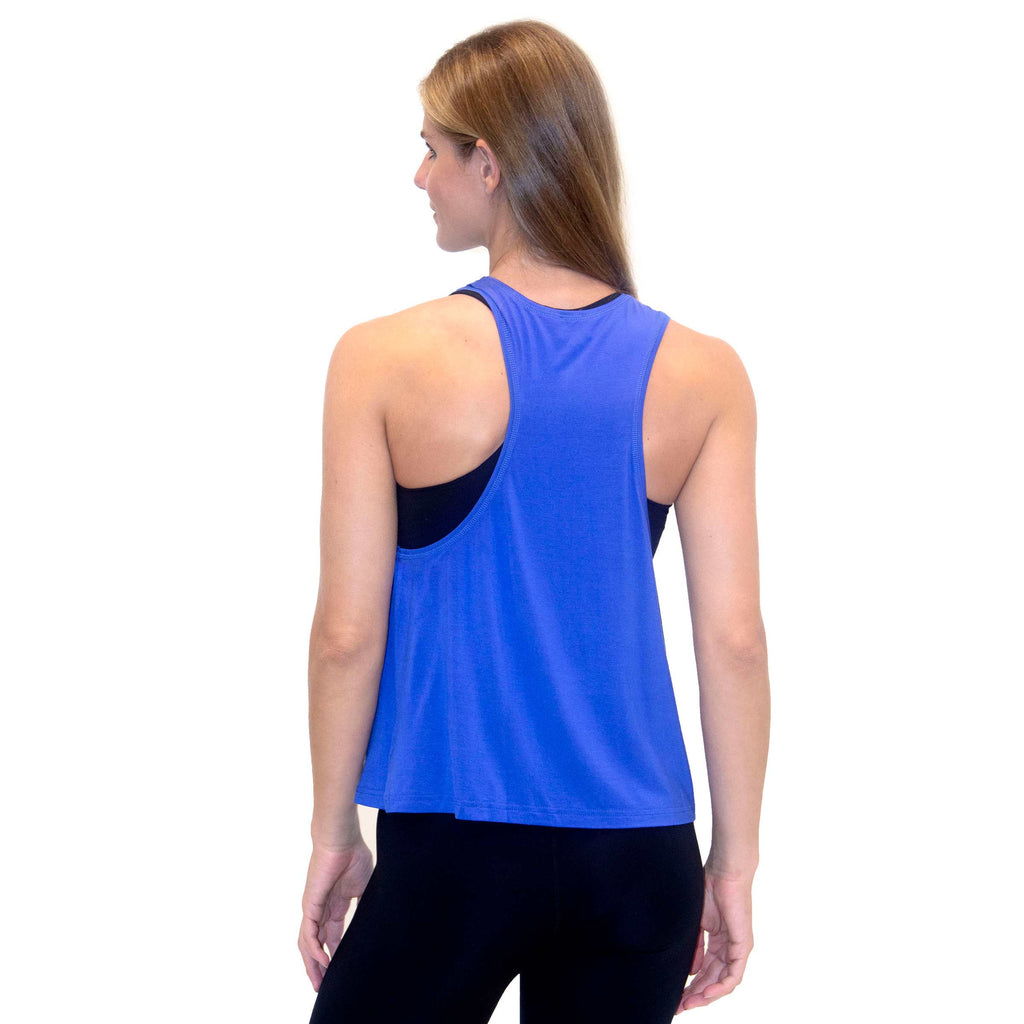 Woman wearing PSK Collective Racerback Tank Top in amparo blue color back view