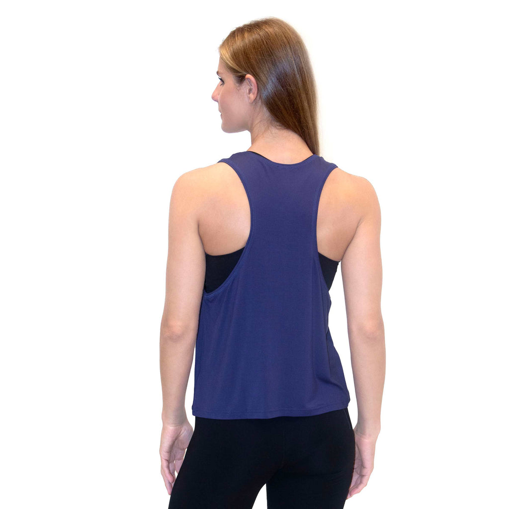 Woman wearing PSK Collective Racerback Tank Top in cobalt color back view