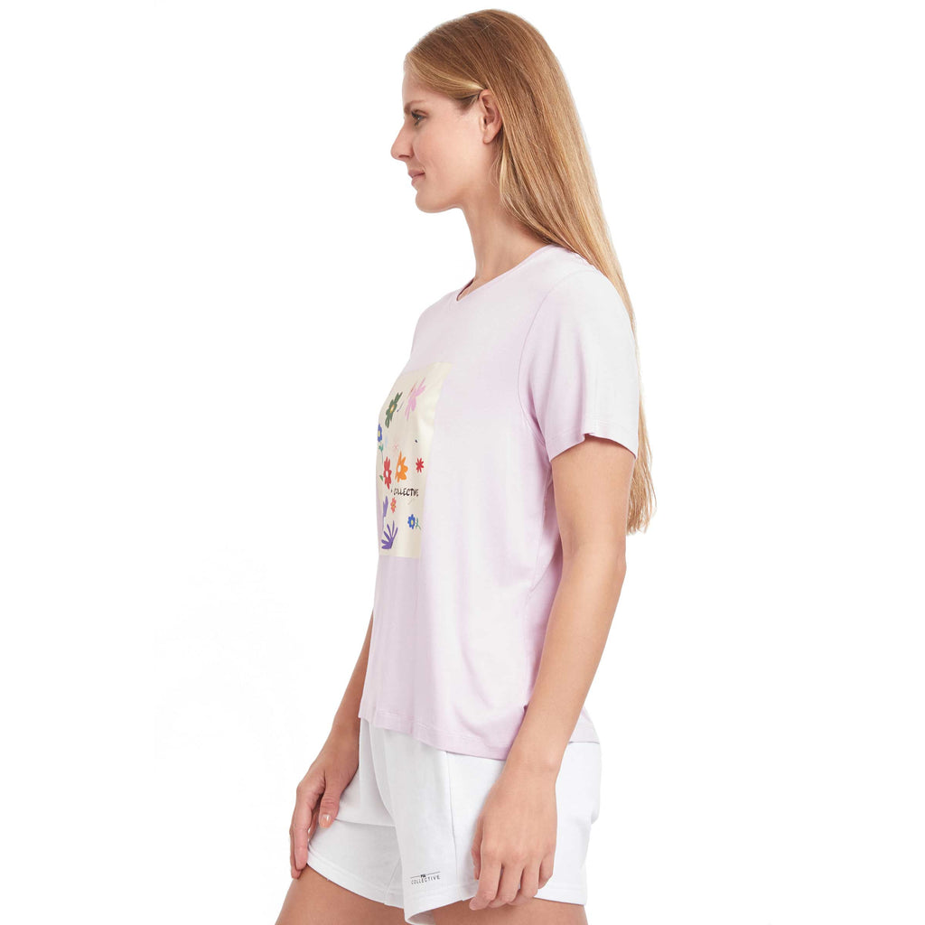 Woman wearing PSK Collective Floral Graphic Tee in fading rose color side view