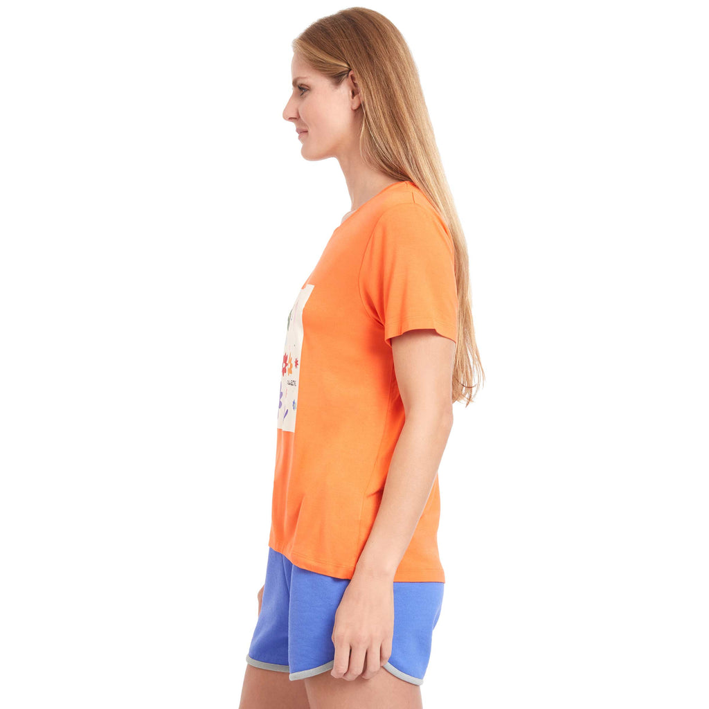 Woman wearing PSK Collective Floral Graphic Tee in orange color side view