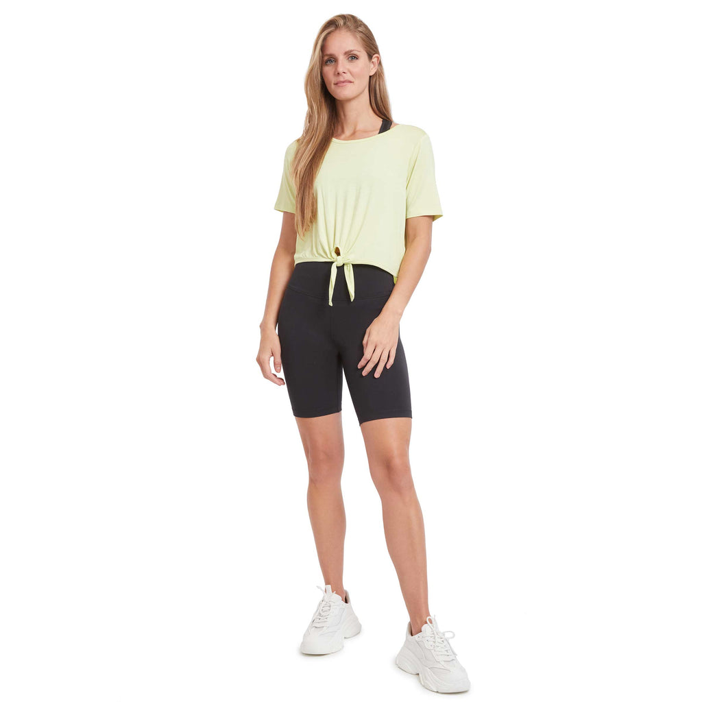 Woman wearing PSK Collective Tie Front Top in pale lime color full body view